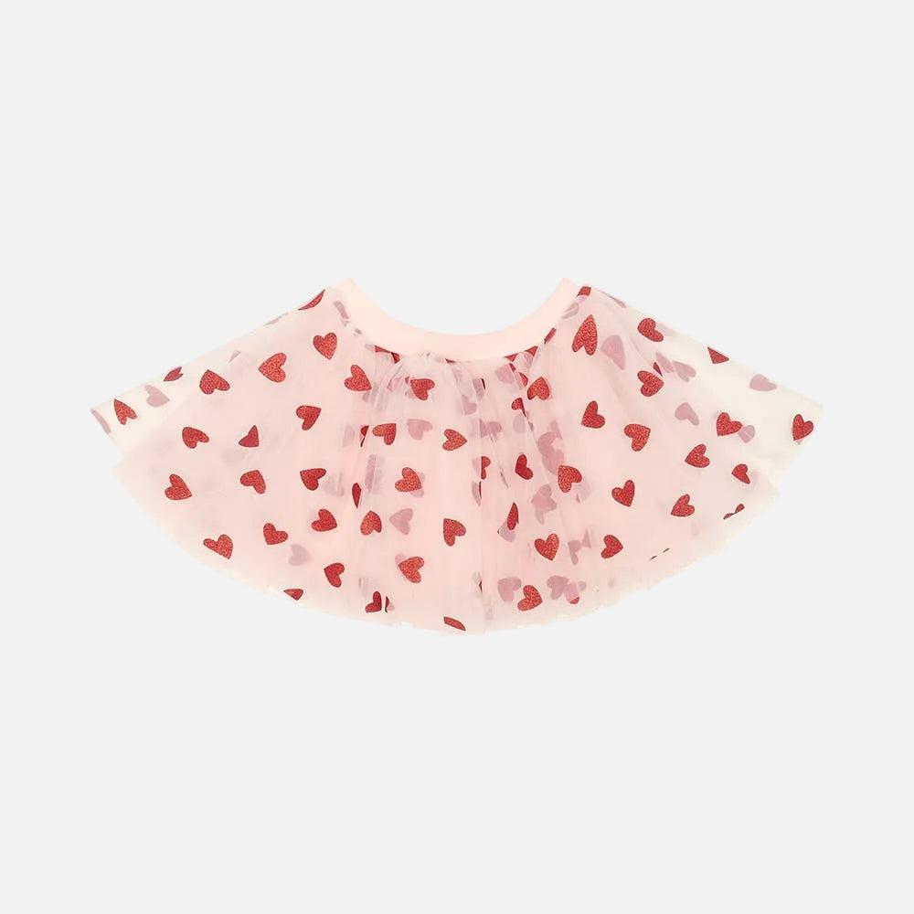 Pink tutu skirt with red heart pattern on a white background