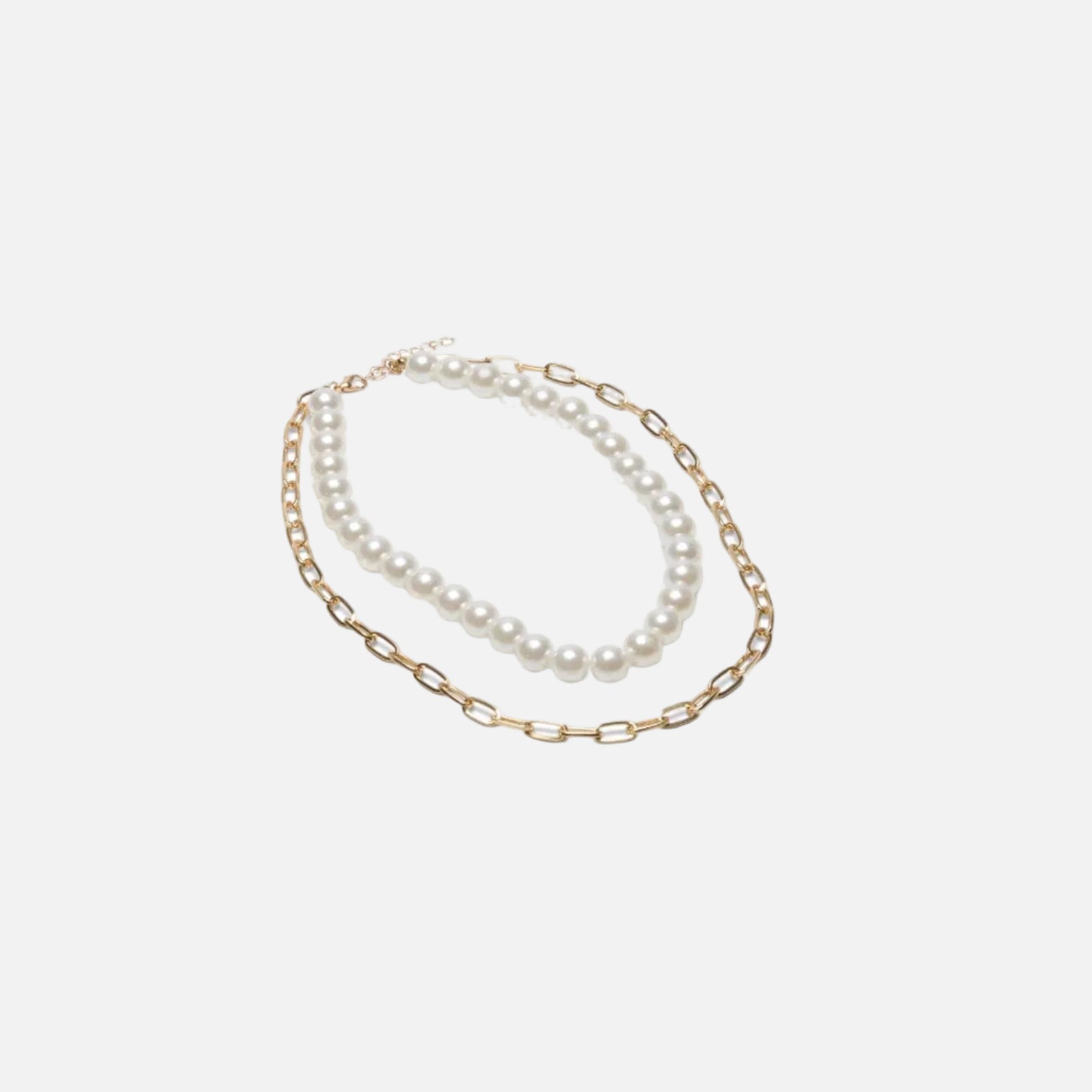 Two pearl necklaces on a gold chain against a white background