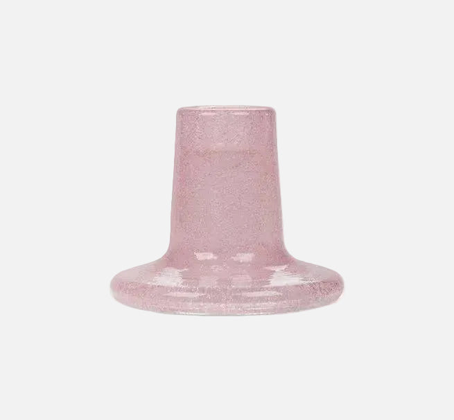 Pink textured candle holder on a white background