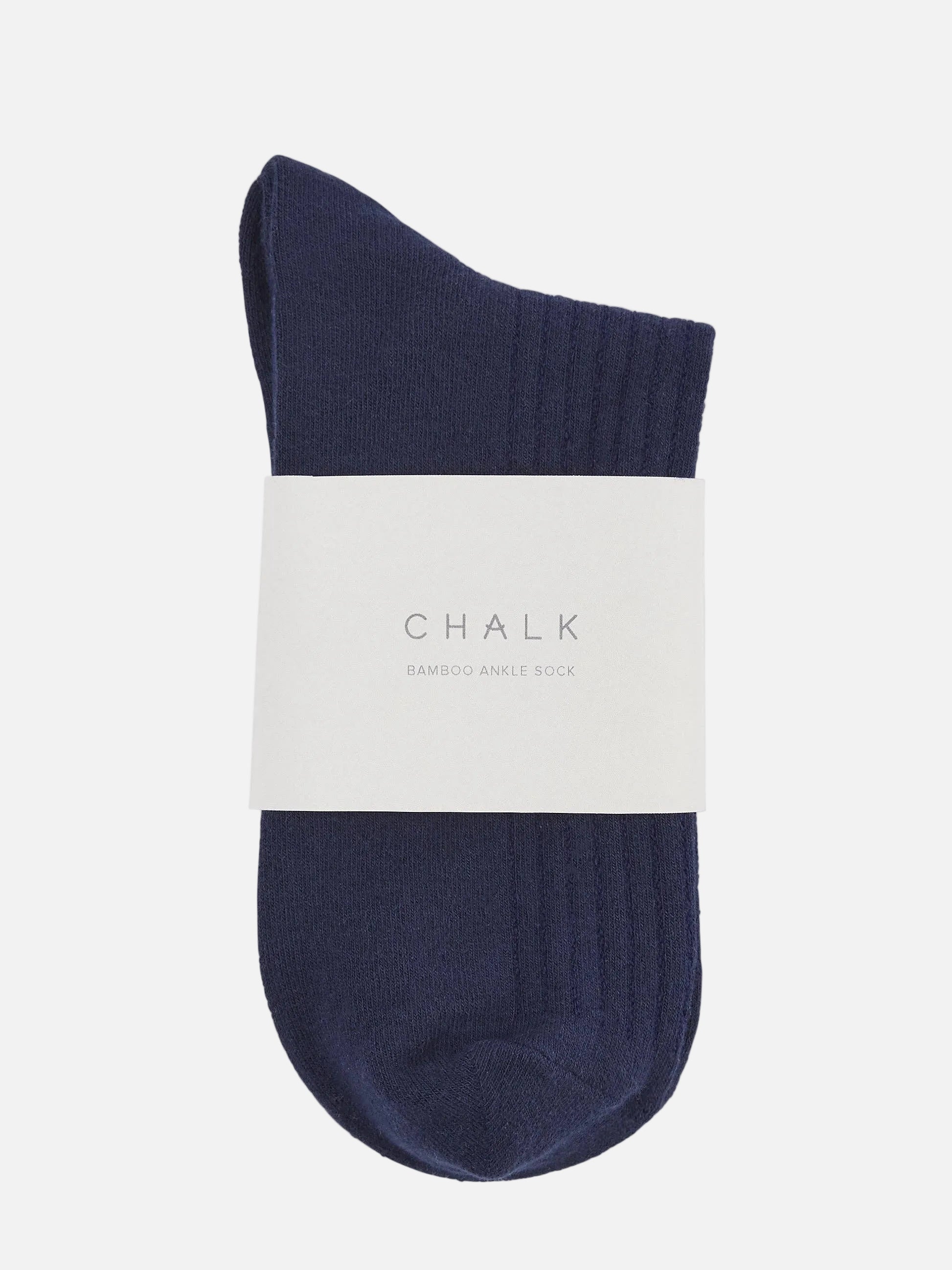 Navy sock with a white label on a white background