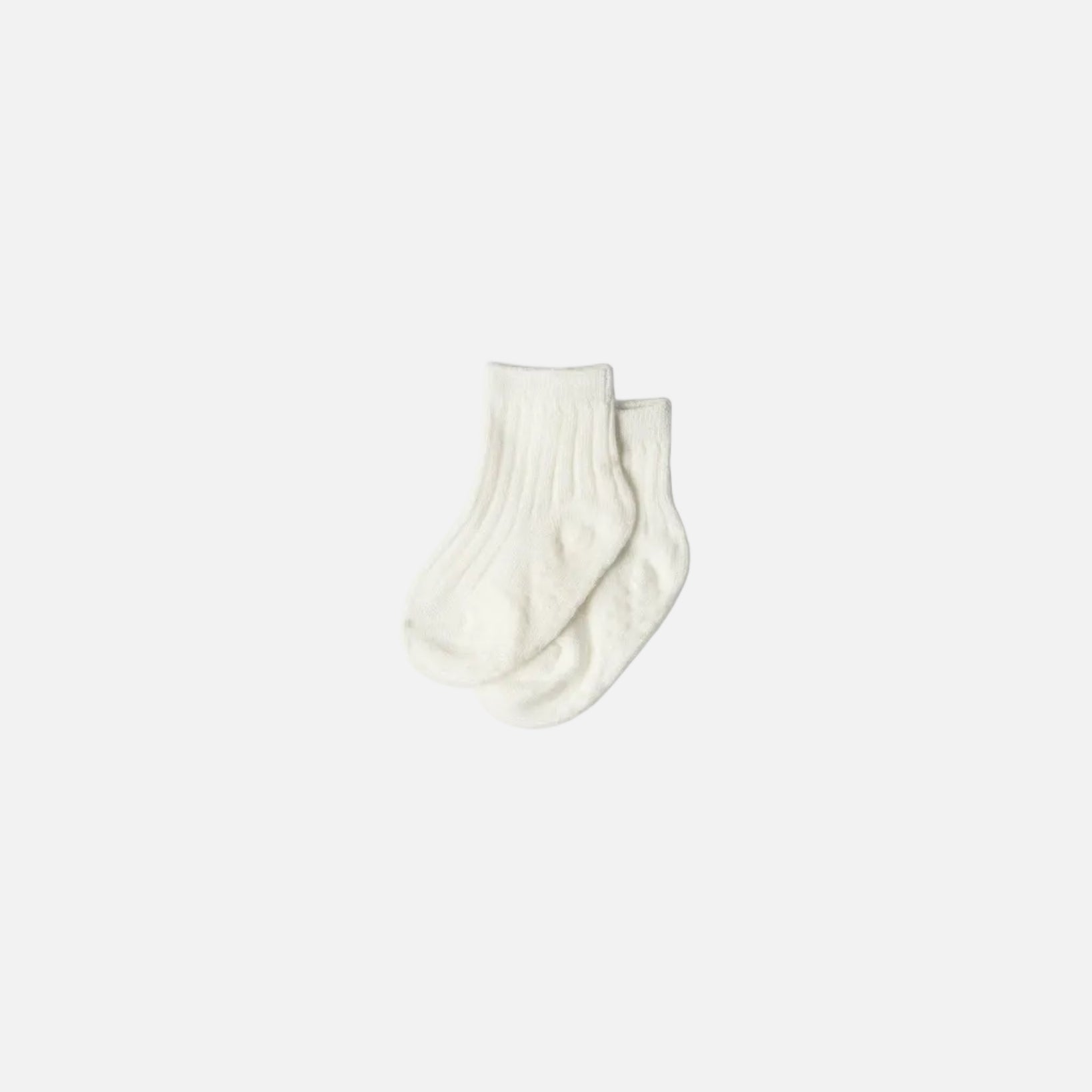 Pair of ivory socks on a white background