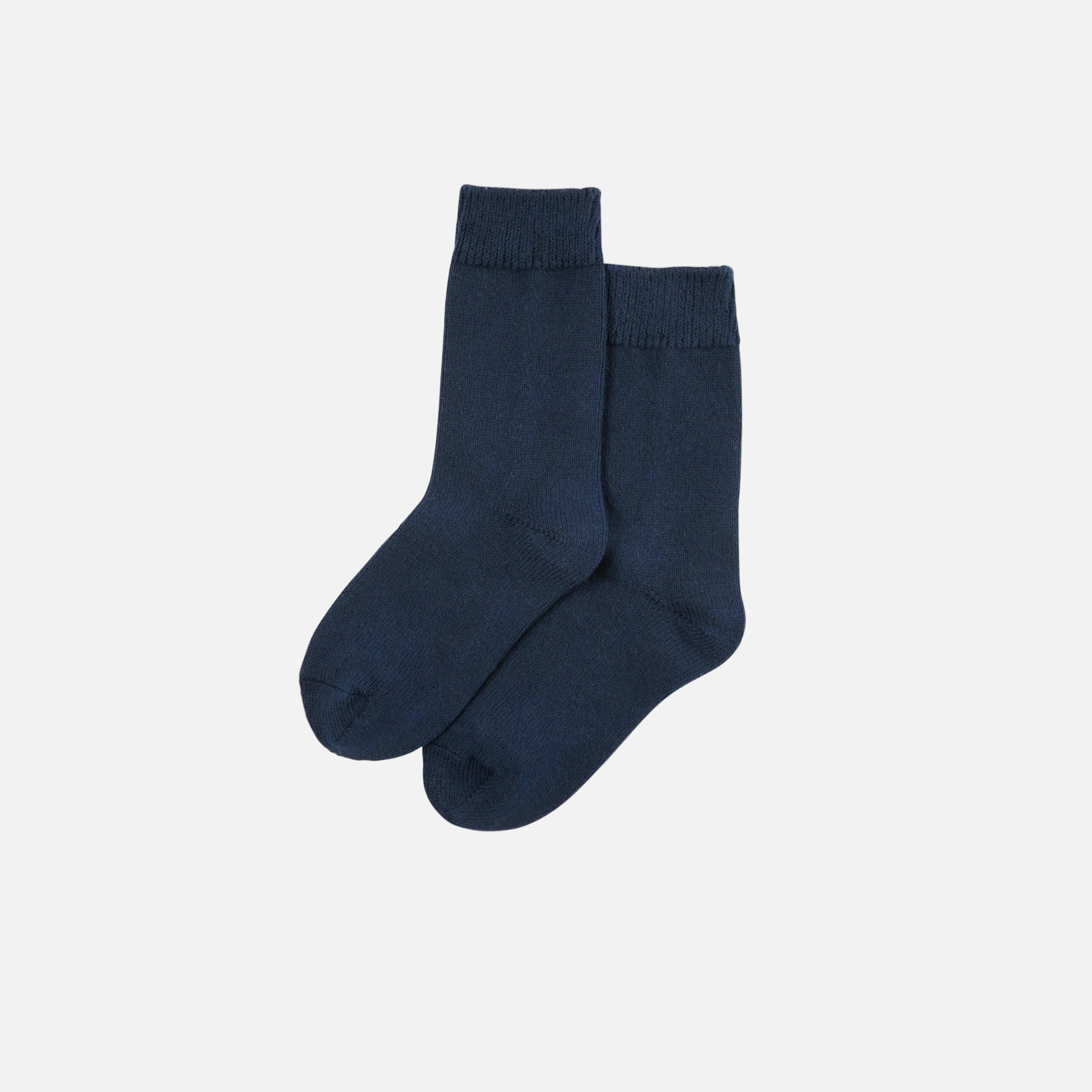 Pair of navy blue socks on a white background