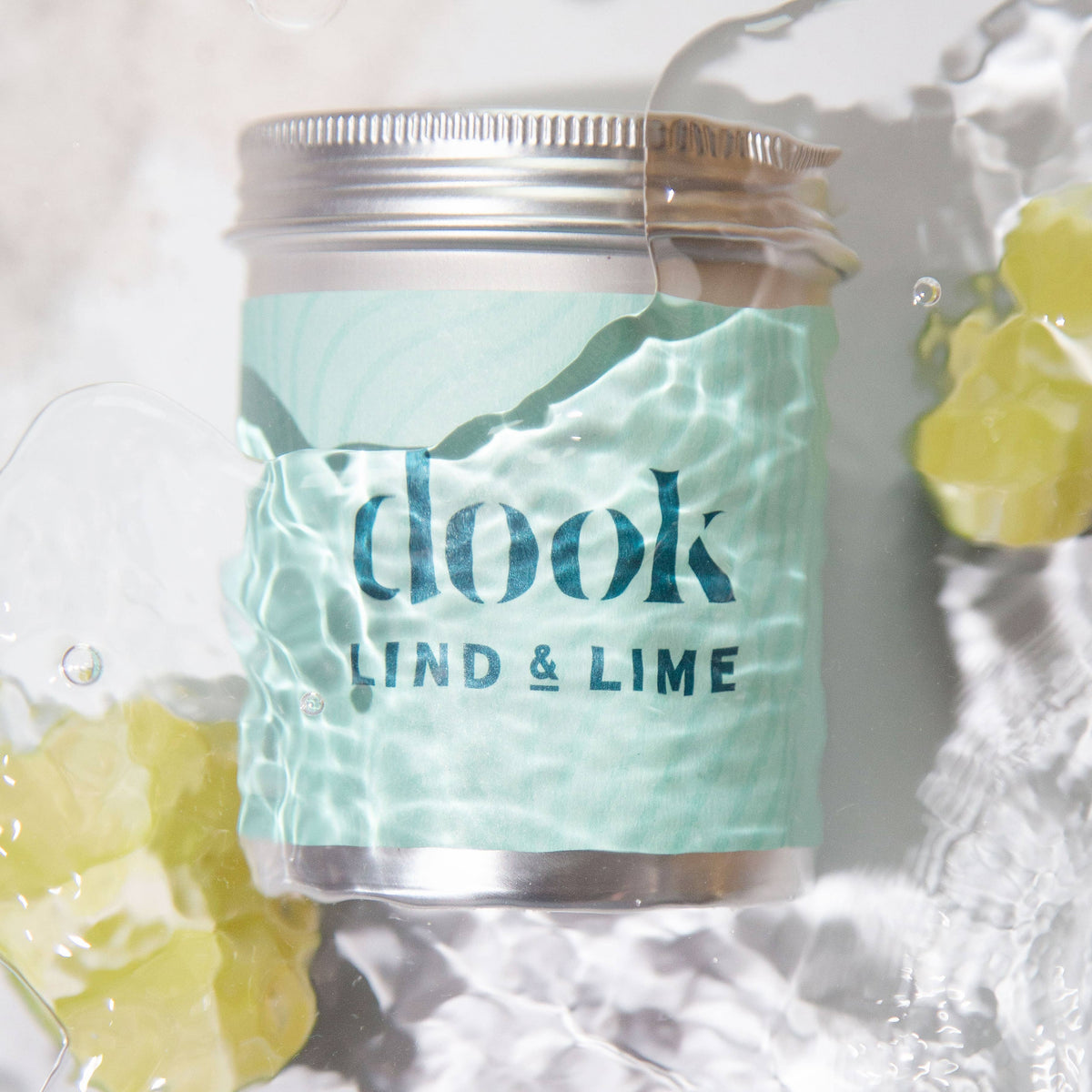 Jar of 'dook' product with 'Lind & Lime' label on a textured white background