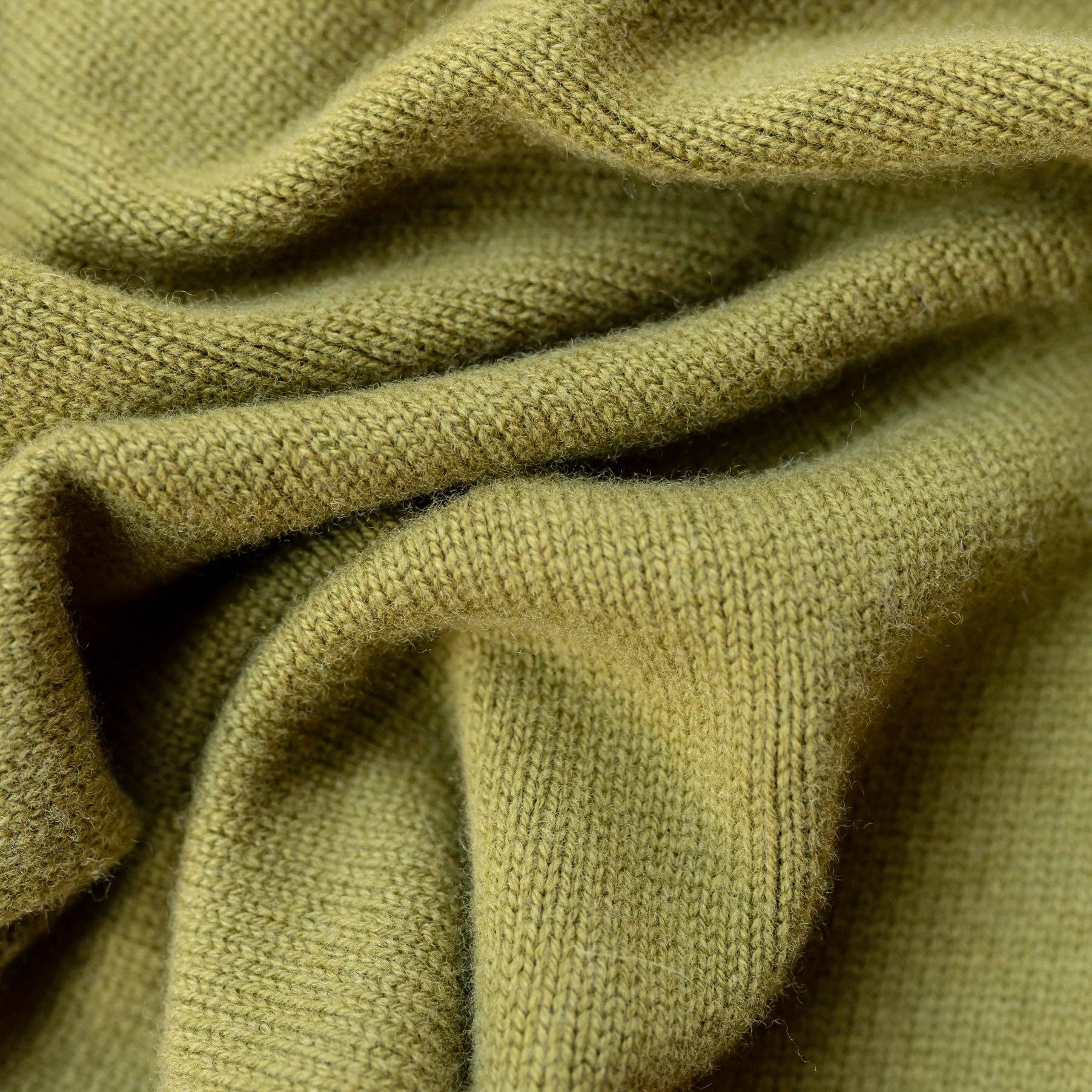 Close-up of greenmerino wool scarf with a textured pattern