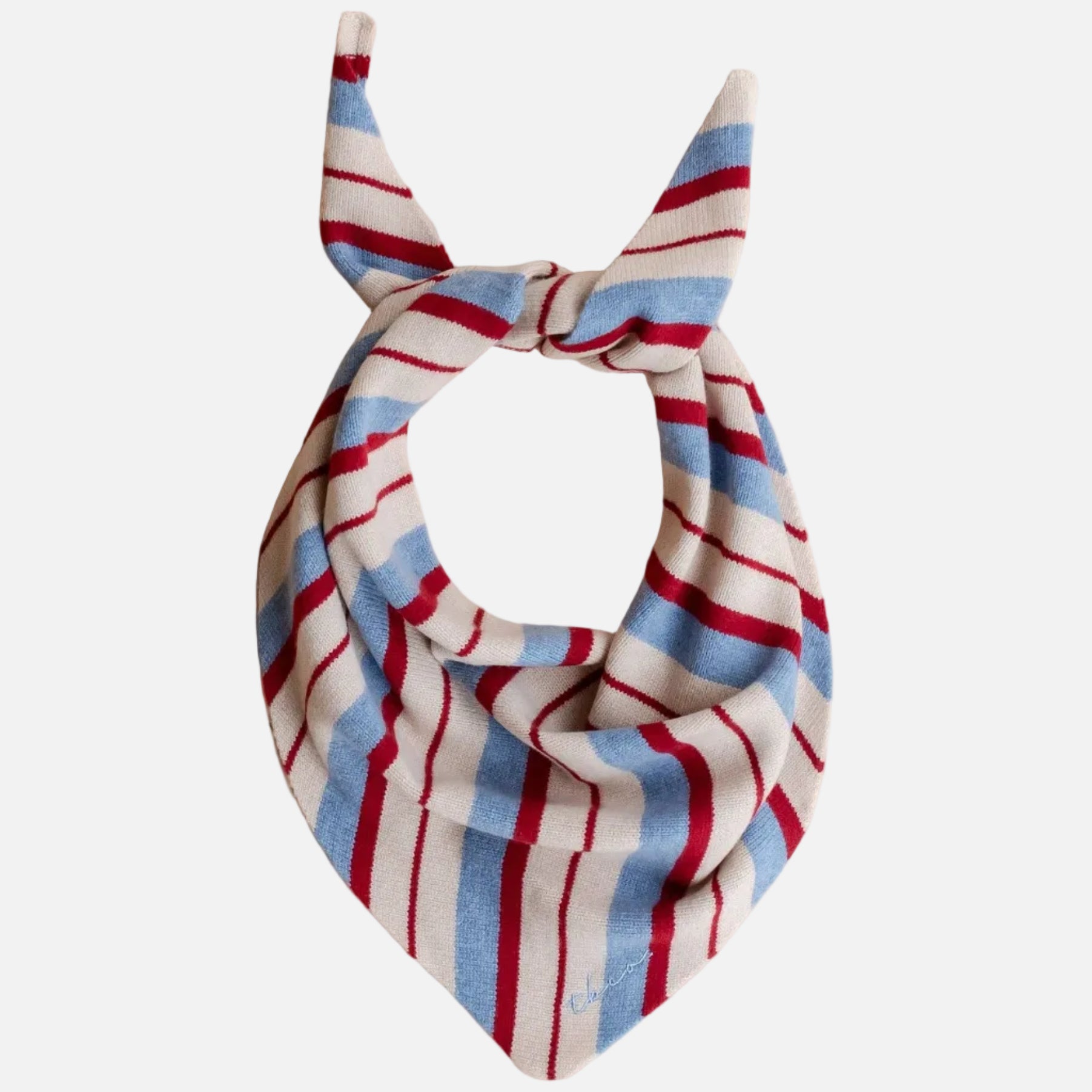 Striped triang scarf with bow on a wooden surface
