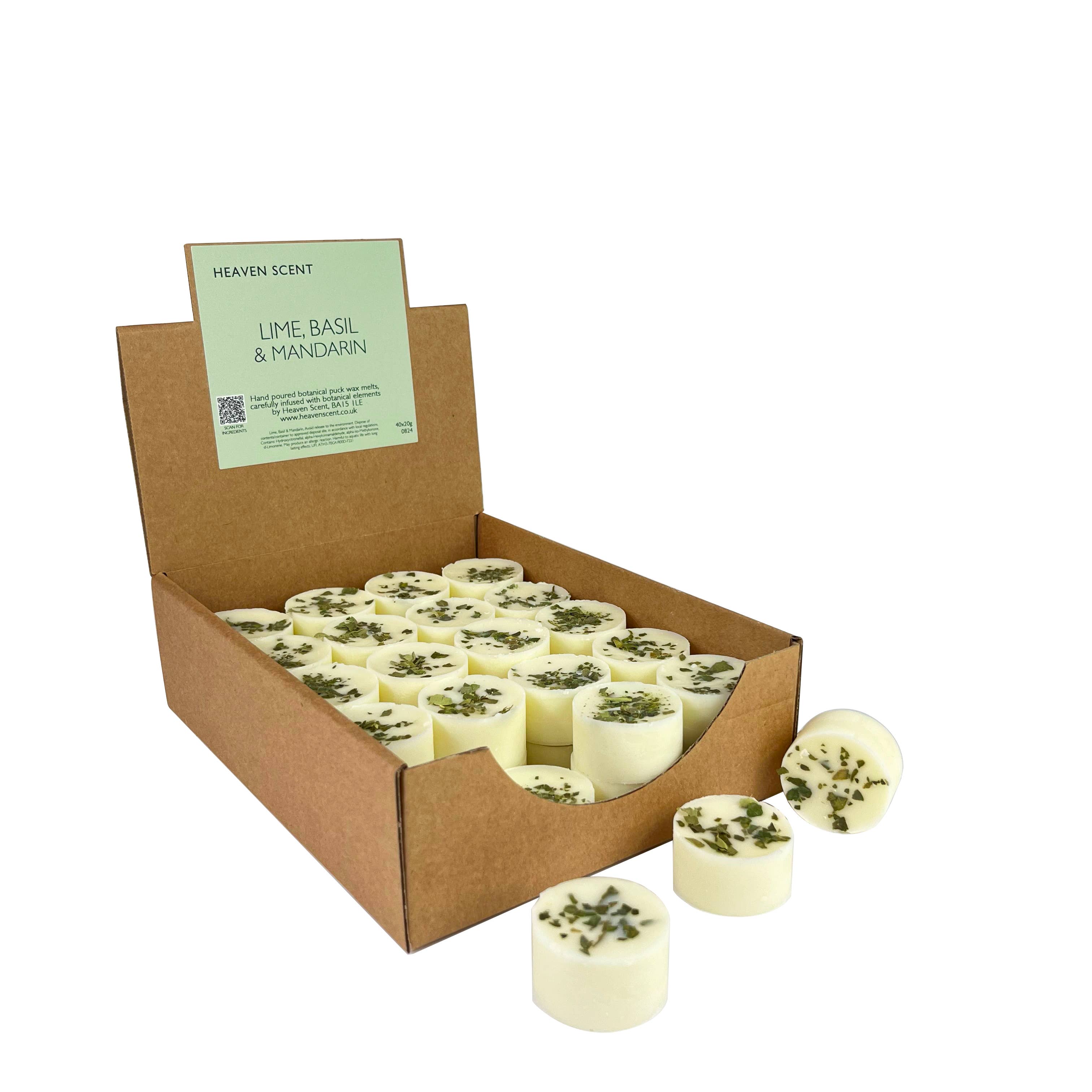 Box of lime basil and mandarin scented candles with a visible brand label.