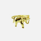 Gold elephant-shaped ring on a white background