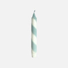 Striped candle on a white background