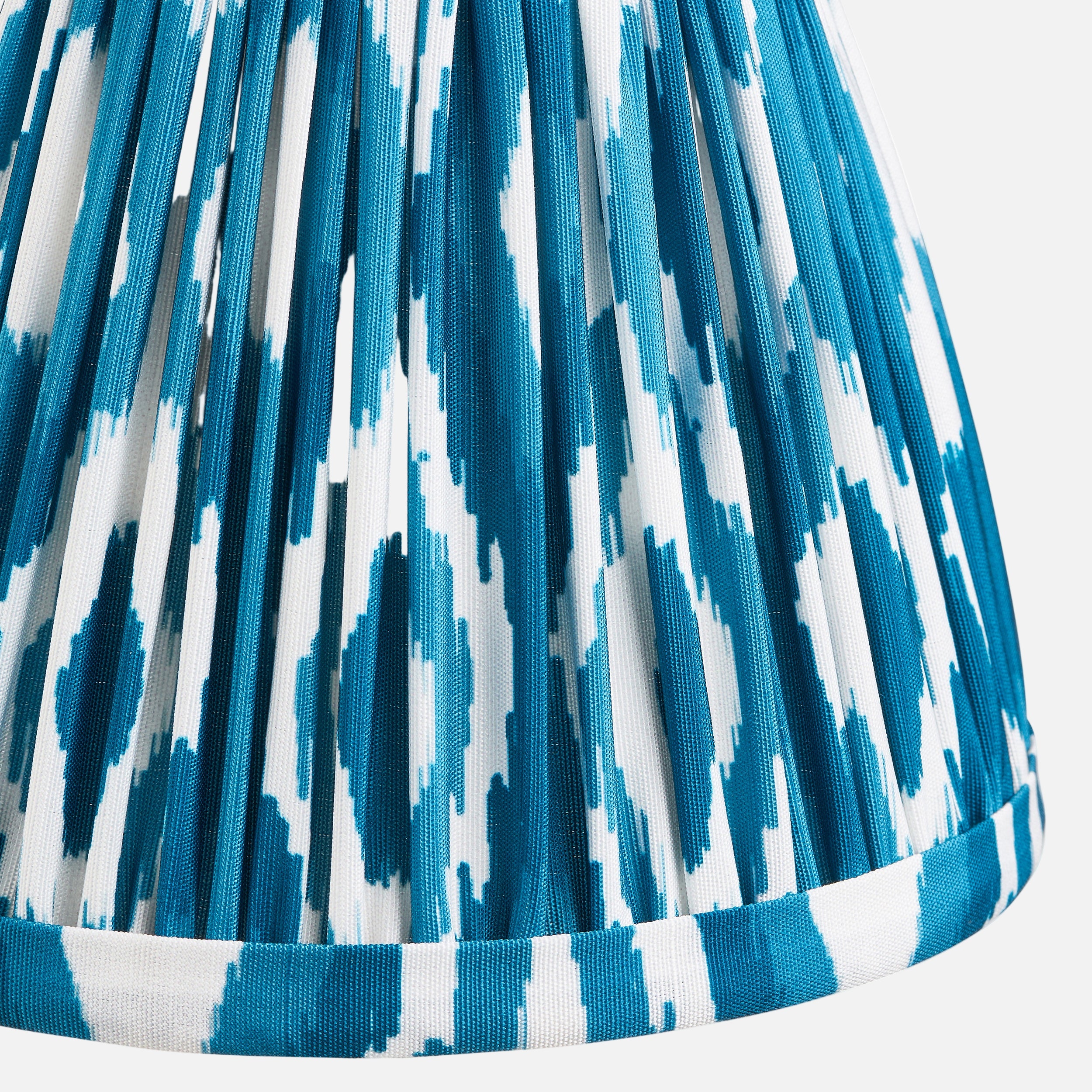 Close-up of a pleated fabric with blue and white pattern