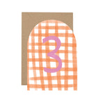 Greeting card with a pink number '3' on an orange and white checkered background