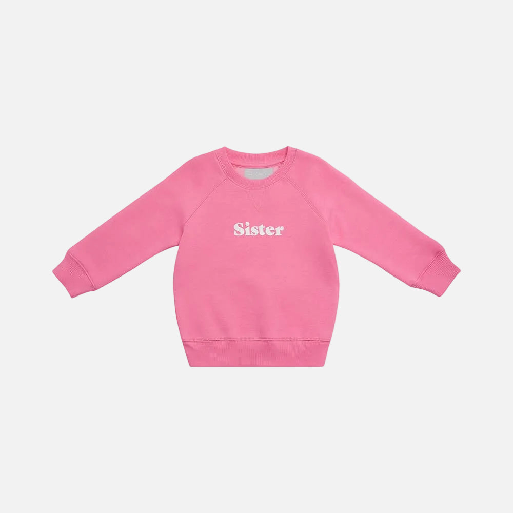 Pink sweatshirt with 'Sister' text on a white background