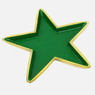 Green star-shaped dish with gold rim on a white background