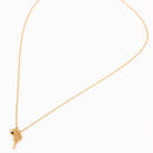 Gold necklace with a heart-shaped pendant on a white background