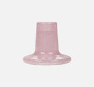 Pink textured candle holder on a white background