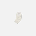 Ivory ankle sock with 'mimi' branding on a white background