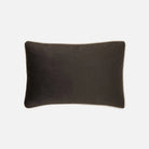 Dark brown oblong cushioin on a white background