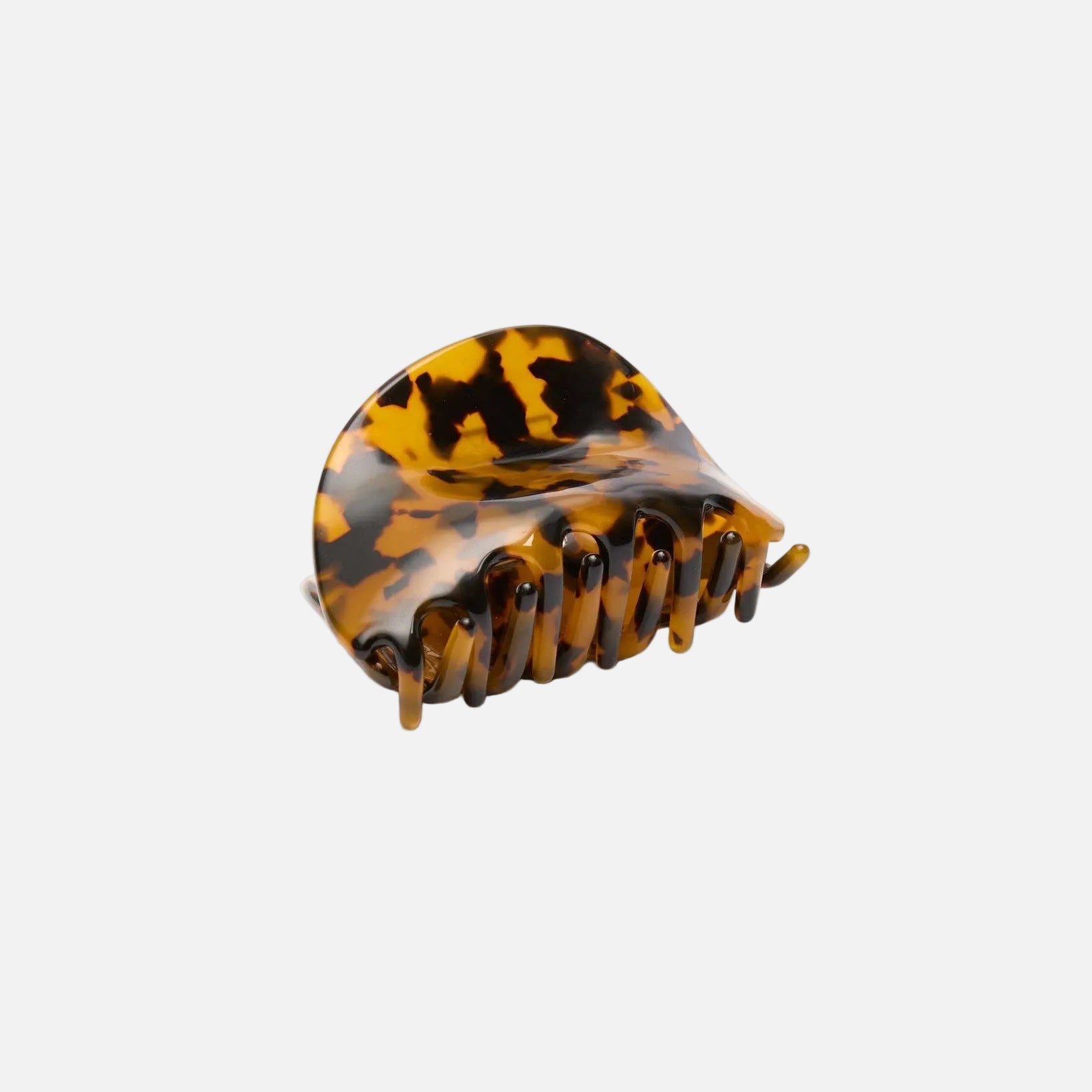 Tortoiseshell hair comb on a white background