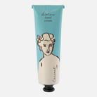 Hand cream tube with a blue label featuring a vintage-style illustration of a woman's face.