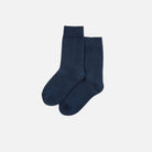 Pair of navy blue socks on a white background