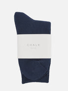 Navy sock with a white label displaying 'CHALK' on a white background