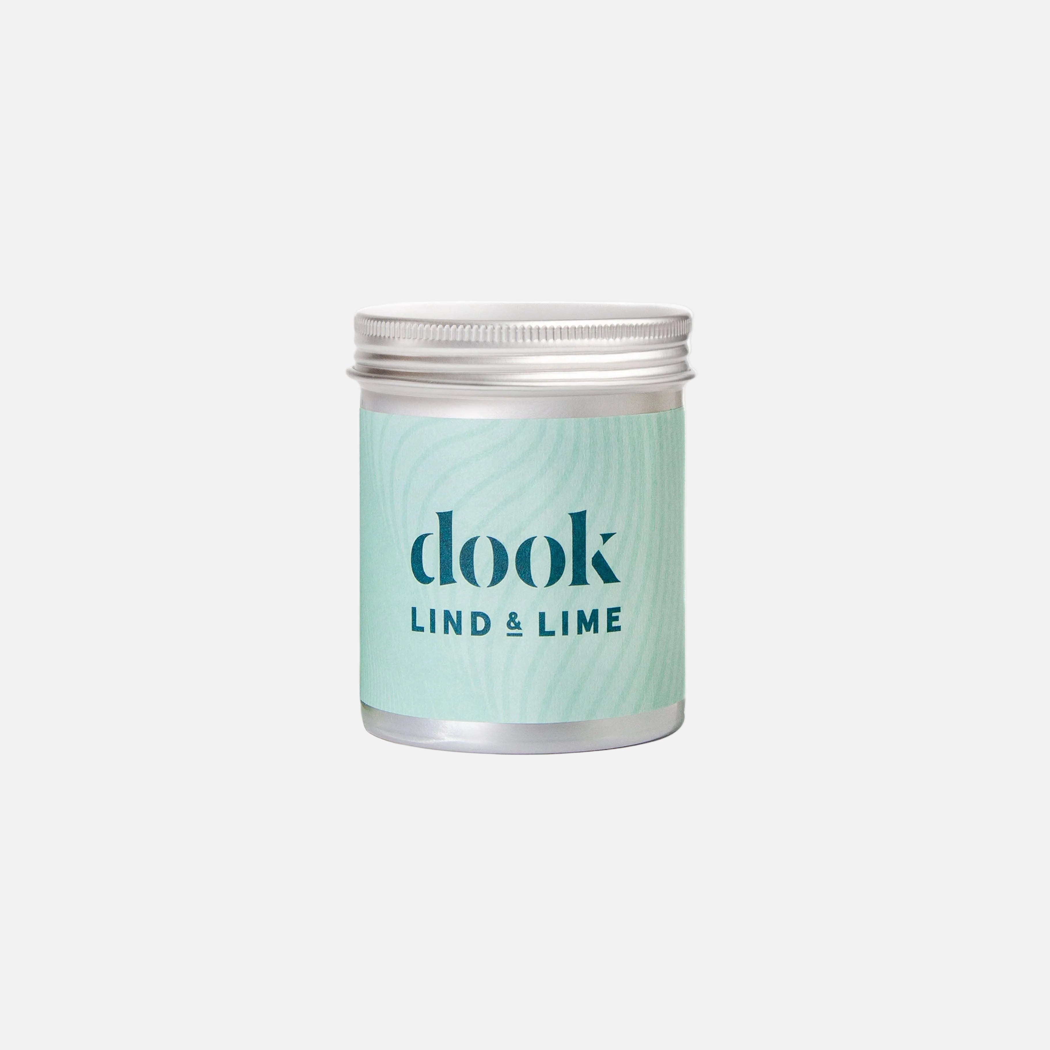 Candle jar labeled 'dook Lind & Lime' on a white background