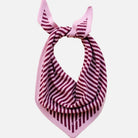 Pink and red striped scarf with a knot on a beige background