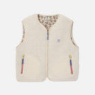 Beige fleece vest with colorful zippers on a white background
