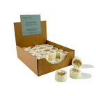 Box of 'Heaven Scent' Rosemary, Sage & Thyme candles with two candles displayed in front on a white background.